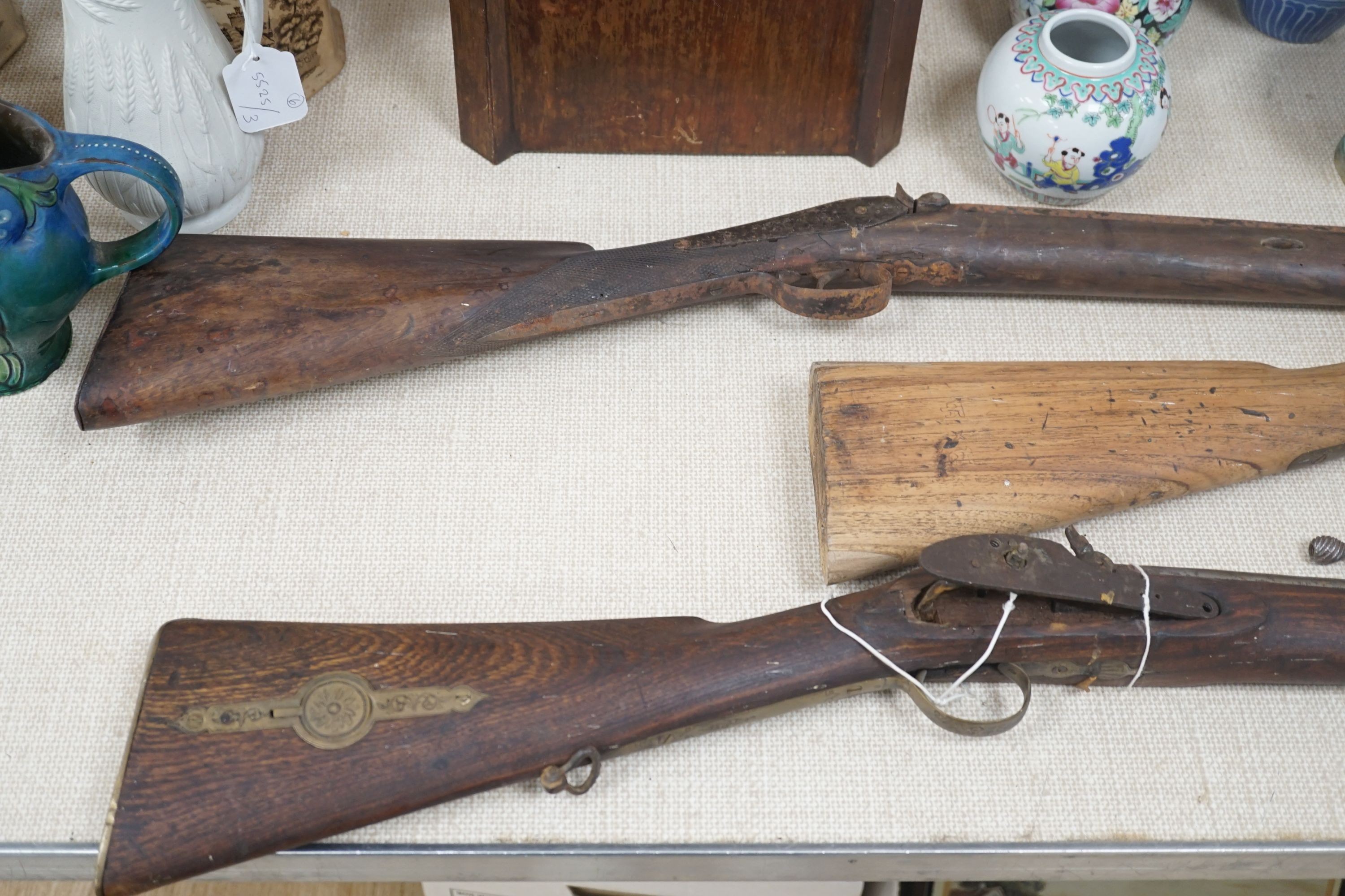 Three 19th century percussion rifles, (each in need of restoration), and a Belgian ramrod, longest 134 cms.